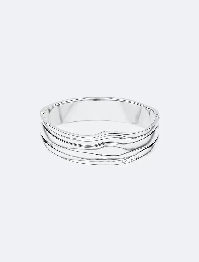 Bracelet rigide à charnière aux formes fluides et sculpturales Bracelet rigide à charnière aux formes fluides et sculpturales