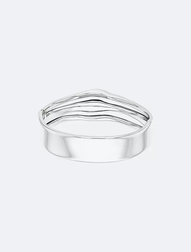 Bracelet rigide à charnière aux formes fluides et sculpturales Bracelet rigide à charnière aux formes fluides et sculpturales