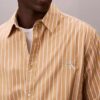 Chemise boutonnée en popeline lavée à rayures Chemise boutonnée en popeline lavée à rayures