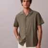 Chemise à manches courtes boutonnée en lin et coton Chemise à manches courtes boutonnée en lin et coton