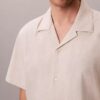 Chemise à manches courtes boutonnée en lin et coton Chemise à manches courtes boutonnée en lin et coton