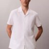 Chemise à manches courtes boutonnée en lin et coton Chemise à manches courtes boutonnée en lin et coton