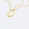 Collier avec pendentif de forme organique arrondie Collier avec pendentif de forme organique arrondie
