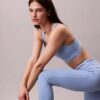 Leggings 7/8 à taille haute et logo, style sportif moderne Leggings 7/8 à taille haute et logo, style sportif moderne