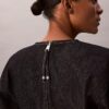 Mini-robe en denim à manches articulées