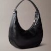 Petit sac à bandoulière convertible aux lignes courbes