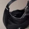 Petit sac à bandoulière convertible aux lignes courbes