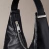 Petit sac à bandoulière convertible aux lignes courbes
