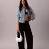 Petit sac à bandoulière convertible aux lignes courbes