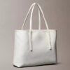 Petit sac fourre-tout avec logo emblématique sur toute la surface et pochette