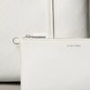 Petit sac fourre-tout avec logo emblématique sur toute la surface et pochette