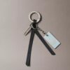 Porte-clés avec logo en lettres cursives Porte-clés avec logo en lettres cursives