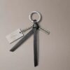 Porte-clés avec logo en lettres cursives Porte-clés avec logo en lettres cursives