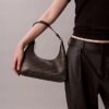 Sac à bandoulière avec logo emblématique sur toute la surface
