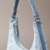 Sac à bandoulière en Denim avec logo emblématique sur toute la surface