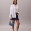 Sac à bandoulière en Denim avec logo emblématique sur toute la surface
