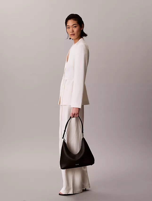 Sac à bandoulière en simili cuir grainé avec logo emblématique Sac à bandoulière en simili cuir grainé avec logo emblématique