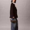 Sac à bandoulière en toile avec logo emblématique sur toute la surface Sac à bandoulière en toile avec logo emblématique sur toute la surface