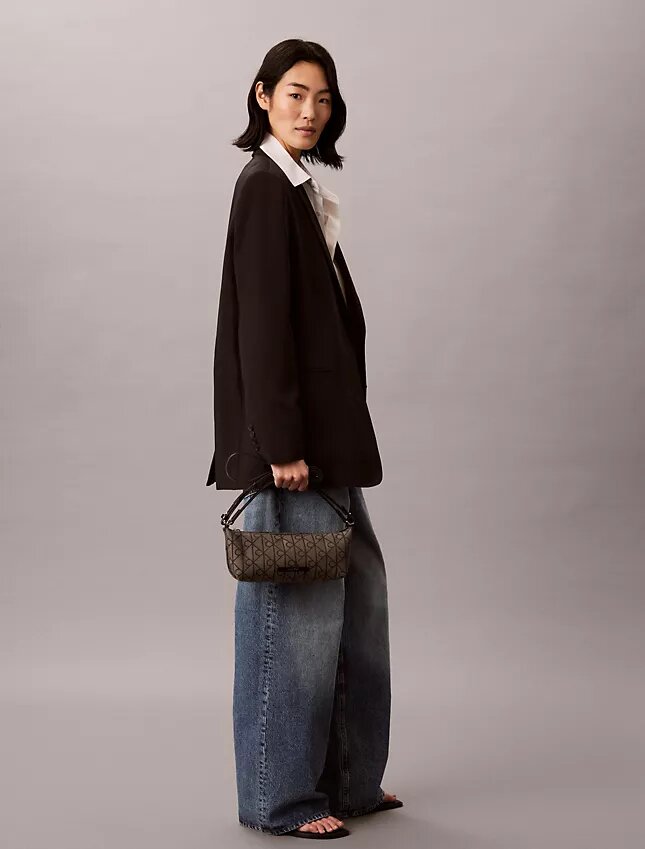 Sac à bandoulière en toile avec logo emblématique sur toute la surface Sac à bandoulière en toile avec logo emblématique sur toute la surface