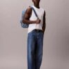 Sac à dos en Denim avec logo emblématique sur toute la surface