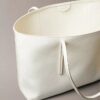 Sac fourre-tout avec logo emblématique sur toute la surface et pochette