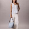 Sac seau en Denim avec logo emblématique sur toute la surface Sac seau en Denim avec logo emblématique sur toute la surface