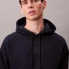 Sweat à capuche en tissu éponge avec logo emblématique Sweat à capuche en tissu éponge avec logo emblématique