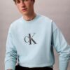 Sweat-shirt ample en tissu éponge haut de gamme avec logo Monogram Sweat-shirt ample en tissu éponge haut de gamme avec logo Monogram